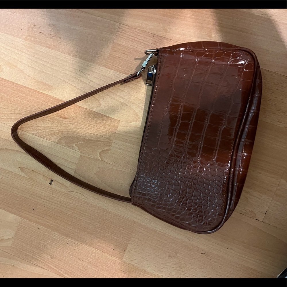 Never used great condition brown shiny bag